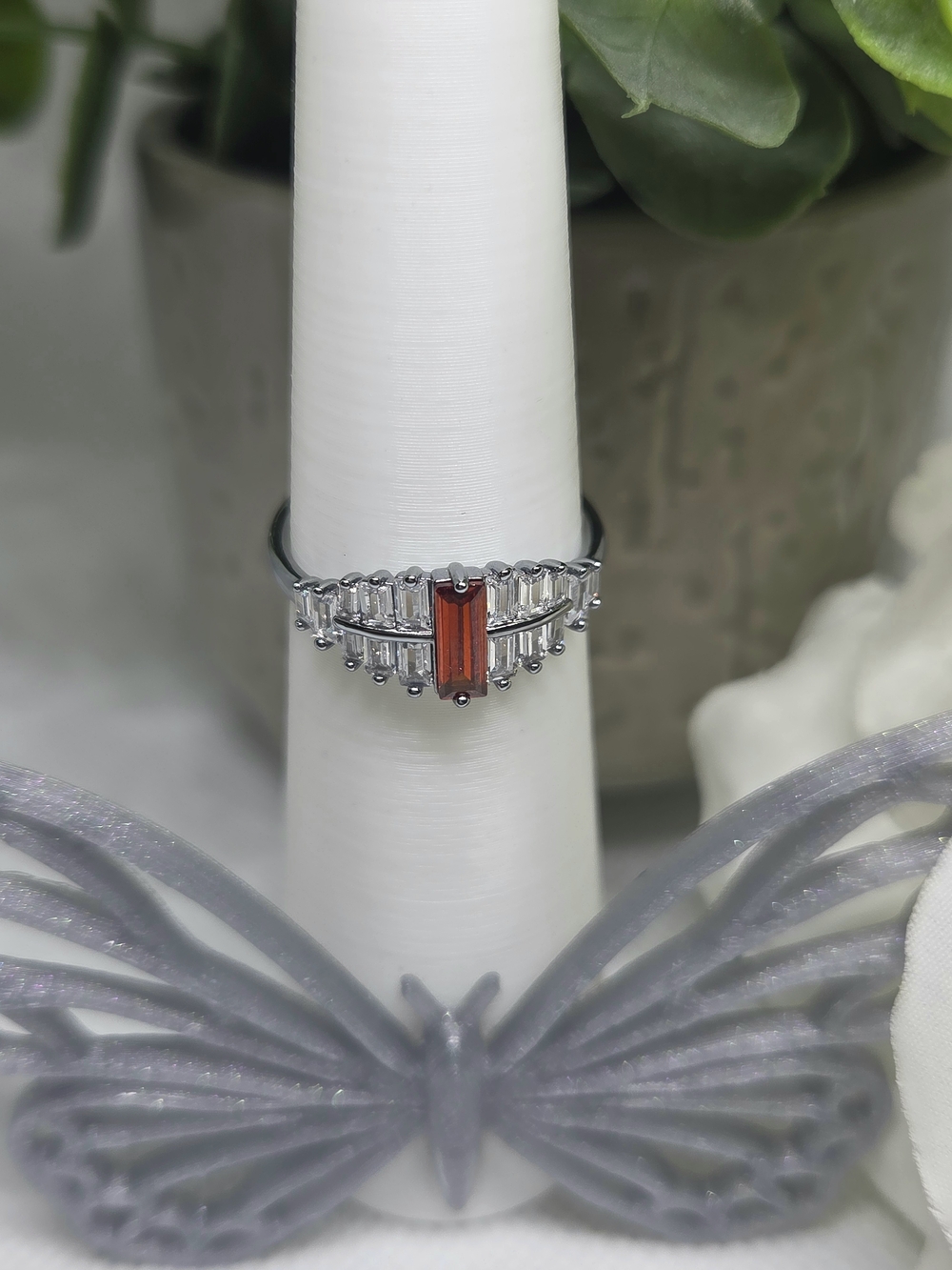 BP Ring with Red Baguette Center Stone And Clear CZ Accents